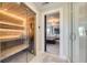 View of sauna, shower, and bedroom doorway featuring modern design and natural light at 1495 W 137Th Ave, Broomfield, CO 80023