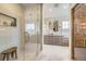 Spa-like bathroom with a glass-enclosed shower, dual vanities, and elegant tile work at 1495 W 137Th Ave, Broomfield, CO 80023