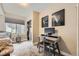 Bedroom featuring a desk, closet, and window with a view of the yard at 1495 W 137Th Ave, Broomfield, CO 80023