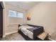 Neutral bedroom with a large window, gray and white blinds, and a modern bed at 1495 W 137Th Ave, Broomfield, CO 80023