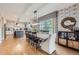 Open concept dining area adjacent to a modern kitchen with hardwood floors at 1495 W 137Th Ave, Broomfield, CO 80023