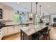 Spacious kitchen with granite countertops, a center island with seating, and modern stainless steel appliances at 1495 W 137Th Ave, Broomfield, CO 80023