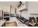Gourmet kitchen features custom cabinetry, sleek countertops, and a high-end stainless steel appliance package at 1495 W 137Th Ave, Broomfield, CO 80023