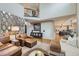 Spacious living room with modern decor and view of a staircase and kitchen at 1495 W 137Th Ave, Broomfield, CO 80023