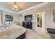 Bright main bedroom with neutral tones, a large dresser, and a view to the walk in closet at 1495 W 137Th Ave, Broomfield, CO 80023