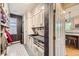 Mudroom featuring built-in cabinets, sink, and stylish patterned tile flooring at 1495 W 137Th Ave, Broomfield, CO 80023