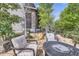 Outdoor patio with fire pit and comfortable seating, ideal for entertaining and relaxing at 1495 W 137Th Ave, Broomfield, CO 80023