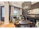 Cozy sitting room with an elegant chandelier, fireplace, and refined decor at 1495 W 137Th Ave, Broomfield, CO 80023