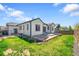 Spacious backyard features a concrete patio, fenced yard, and well-manicured lawn at 6829 Juniper Ct, Frederick, CO 80530