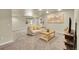Spacious basement living room with cozy carpet, neutral paint, and bright, recessed lighting at 6829 Juniper Ct, Frederick, CO 80530