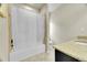 Bathroom featuring tile, a granite countertop, and a bathtub with shower at 6829 Juniper Ct, Frederick, CO 80530