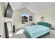 Cozy bedroom with a large window offering a view of the neighborhood at 6829 Juniper Ct, Frederick, CO 80530