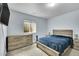 Comfortable bedroom with soft carpet, natural wood furniture, and a modern, minimalist aesthetic at 6829 Juniper Ct, Frederick, CO 80530