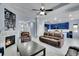 Open-concept living room flowing into a modern kitchen with stainless steel appliances at 6829 Juniper Ct, Frederick, CO 80530