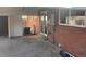Back patio with a brick wall, sliding door, and covered roof, seamlessly blending indoor and outdoor living at 2101 S Lowell Blvd, Denver, CO 80219