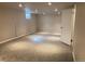 Spacious finished basement featuring carpet, recessed lighting, and a convenient door at 2101 S Lowell Blvd, Denver, CO 80219