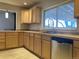 Updated kitchen featuring granite countertops and stainless steel dishwasher at 2101 S Lowell Blvd, Denver, CO 80219