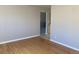 Bright living room with hardwood floors and neutral wall paint at 2101 S Lowell Blvd, Denver, CO 80219