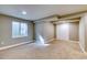 Finished basement features plush carpeting, a large window, and built-in closet at 3849 E 121St Ave, Thornton, CO 80241