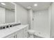 All-white bathroom with a modern vanity and a tiled stand up shower at 3849 E 121St Ave, Thornton, CO 80241
