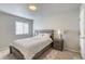 Neutral bedroom with a coordinated furniture set, including a bed and nightstands at 3849 E 121St Ave, Thornton, CO 80241