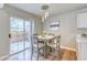 Cozy dining area with sliding glass doors to a deck for easy indoor-outdoor living at 3849 E 121St Ave, Thornton, CO 80241