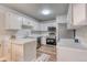 Well-maintained kitchen with stainless steel appliances and bright white cabinets at 3849 E 121St Ave, Thornton, CO 80241