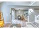 Bright living room seamlessly connects to the dining area and kitchen, creating an open and inviting space at 3849 E 121St Ave, Thornton, CO 80241