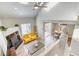 Inviting living room with vaulted ceilings, fireplace, and access to dining area, perfect for entertaining and relaxation at 3849 E 121St Ave, Thornton, CO 80241