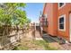 Backyard view highlighting the deck, stairs, and partial fencing at 19595 Mitchell Dr, Denver, CO 80249