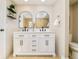 Beautiful bathroom featuring a dual sink vanity, sleek black hardware, and modern design elements at 19595 Mitchell Dr, Denver, CO 80249