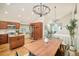 Open concept dining room showcasing the kitchen, eating space, and a view into the living room at 19595 Mitchell Dr, Denver, CO 80249