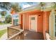 Inviting side entryway boasts a cozy porch with a wooden railing, perfect for enjoying the outdoors at 19595 Mitchell Dr, Denver, CO 80249