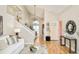 Spacious open-concept living area with high ceilings, light wood floors, and seamless flow to the dining area at 19595 Mitchell Dr, Denver, CO 80249