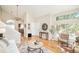 Inviting living room with hardwood floors, vaulted ceiling, and an open layout at 19595 Mitchell Dr, Denver, CO 80249