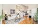Bright and airy living room featuring high ceilings, hardwood floors, and stylish decor at 19595 Mitchell Dr, Denver, CO 80249