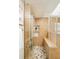 Modern shower area with sleek glass doors, stylish tile work, and convenient built-in shelving at 19595 Mitchell Dr, Denver, CO 80249