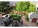 Multi-tiered deck overlooking a grassy backyard with a storage shed at 10218 Woodrose Ct, Highlands Ranch, CO 80129