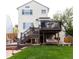 Multi-level deck with a swing and stairs down to the patio and yard at 10218 Woodrose Ct, Highlands Ranch, CO 80129