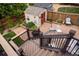 Multi-tiered deck with brick patio, shed, and fenced yard at 10218 Woodrose Ct, Highlands Ranch, CO 80129