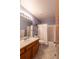 Bathroom with a bathtub and shower with a vanity with framed mirror at 10218 Woodrose Ct, Highlands Ranch, CO 80129