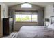 Calm main bedroom with vaulted ceiling, large windows and a view of the outdoors at 10218 Woodrose Ct, Highlands Ranch, CO 80129