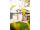 Charming home exterior with a three-car garage and well-kept lawn at 10218 Woodrose Ct, Highlands Ranch, CO 80129