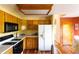 Well-equipped kitchen with appliances, ample cabinet space, and hardwood floors at 10218 Woodrose Ct, Highlands Ranch, CO 80129