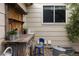 Rustic outdoor workspace with wooden counter and shelves, creating a charming area for gardening and projects at 10218 Woodrose Ct, Highlands Ranch, CO 80129