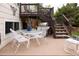 Outdoor patio with dining set and grill, leading to the backyard at 10218 Woodrose Ct, Highlands Ranch, CO 80129