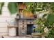 Outdoor potting table surrounded by greenery in the backyard at 10218 Woodrose Ct, Highlands Ranch, CO 80129