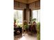 Sunroom featuring multiple plants and large windows, creating a cozy and bright space at 10218 Woodrose Ct, Highlands Ranch, CO 80129