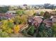 Aerial view of home featuring mature trees and private backyards and a distant view of the city at 119 Ward Ct, Lakewood, CO 80228