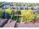 Aerial view showcasing backyard with mature trees, manicured lawn, garden boxes and surrounding community at 119 Ward Ct, Lakewood, CO 80228